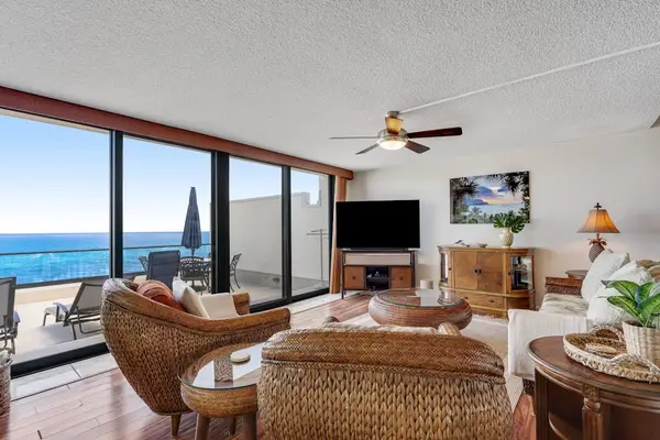 Inviting living room with floor-to-ceiling windows that bring the beauty of the ocean indoors