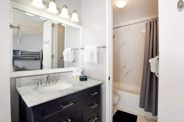 Bright Second Bathroom With Vanity Space