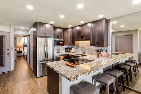 Fully remodeled kitchen with large island with bar seating.