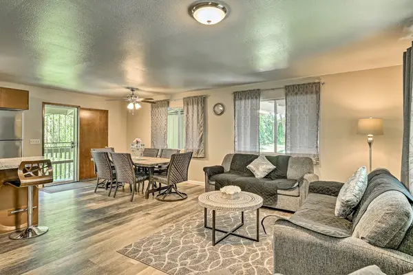Living room open to the kitchen and dining room with a conformable sofa bed for extra company.