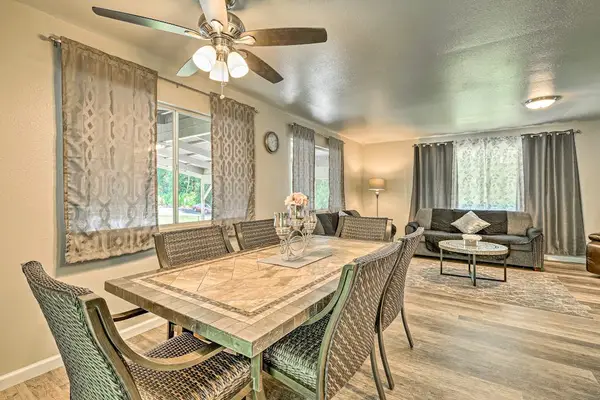 Dining room table steps aways from the kitchen and seating for six.