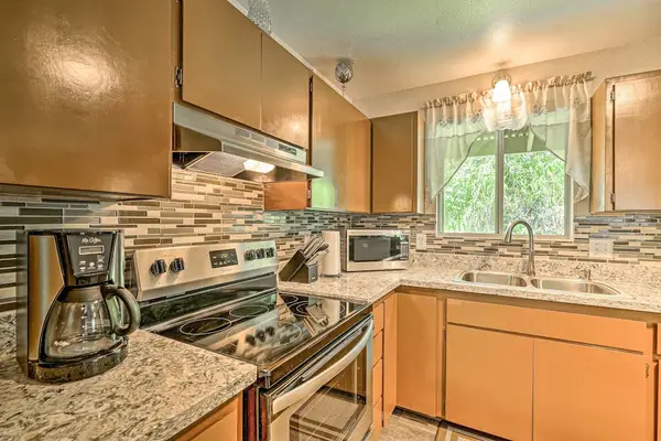 Fully remodeled kitchen with stainless steel appliances.
