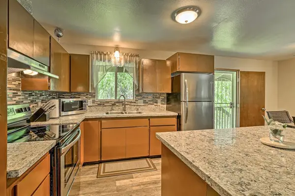Fully remodeled kitchen with stainless steel appliances.