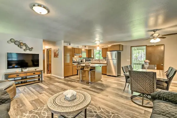 Large open living room to the kitchen and dining room.