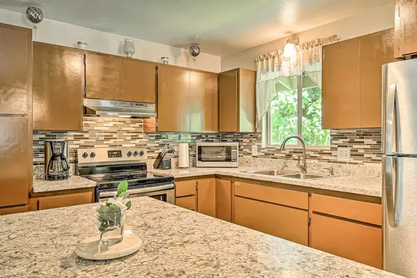 Fully remodeled kitchen with stainless steel appliances.