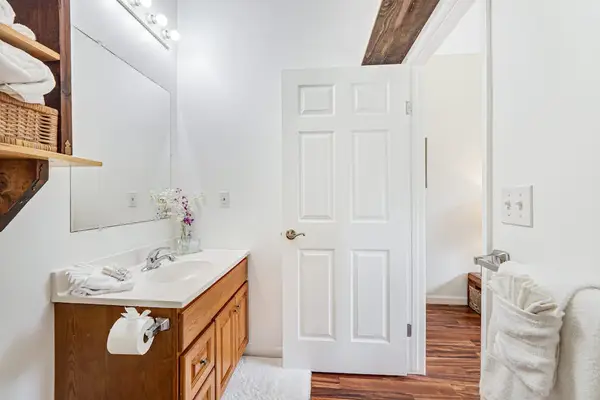 Full bathroom with tub/shower combo.