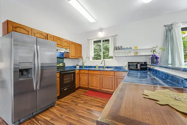 Large fully stocked kitchen open to the living and dining room so that you can always stay with your company.