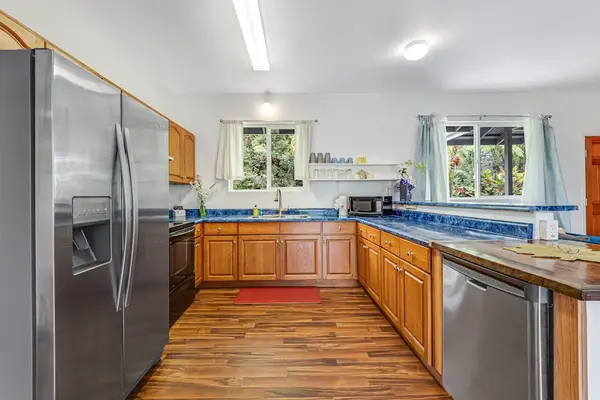 Large fully stocked kitchen open to the living and dining room so that you can always stay with your company.