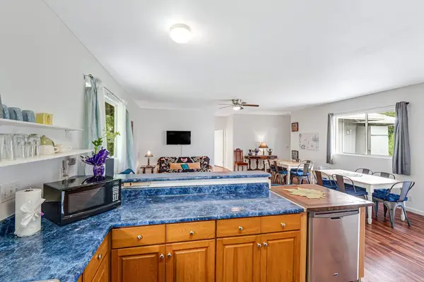 Large fully stocked kitchen open to the living and dining room so that you can always stay with your company.