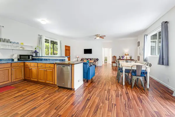 Large fully stocked kitchen open to the living and dining room so that you can always stay with your company.