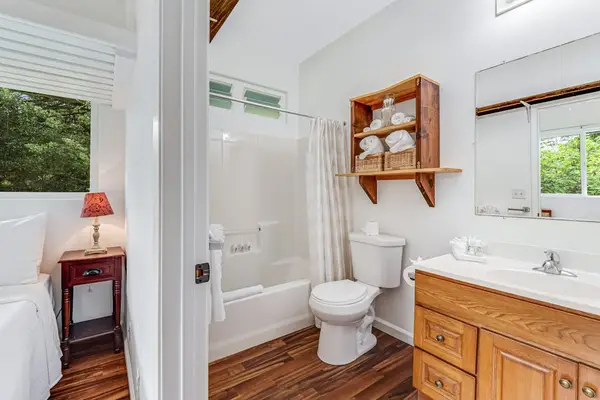 Full bathroom with tub/shower combo.