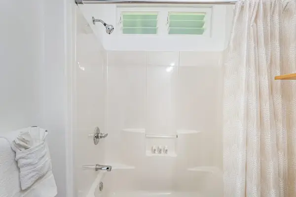 Full bathroom with tub/shower combo.