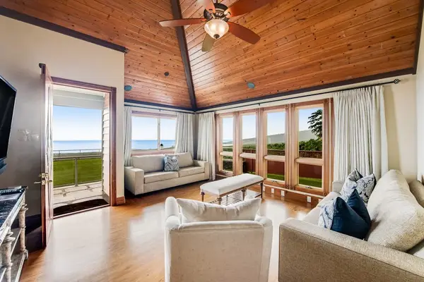 Open-Concept Living Area with Direct Patio Access & Ceiling Fan