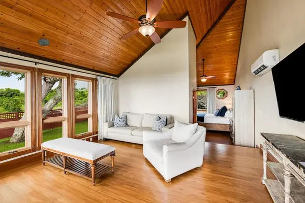 Sunlit Living Room with Vaulted Wood Ceilings & Ocean Views