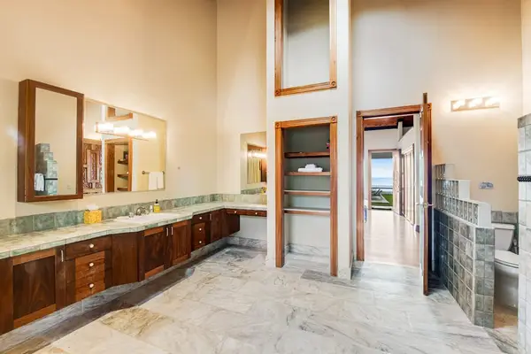 Spacious Guest En-Suite with Expansive Vanity & Built-In Storage
