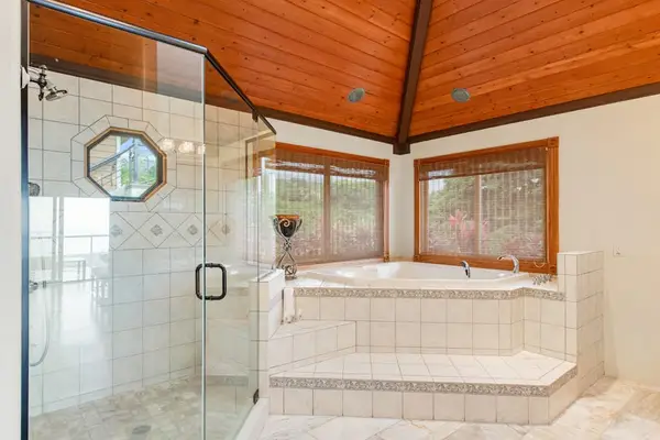 Luxury En-Suite Bathroom with Soaking Tub & Glass Shower