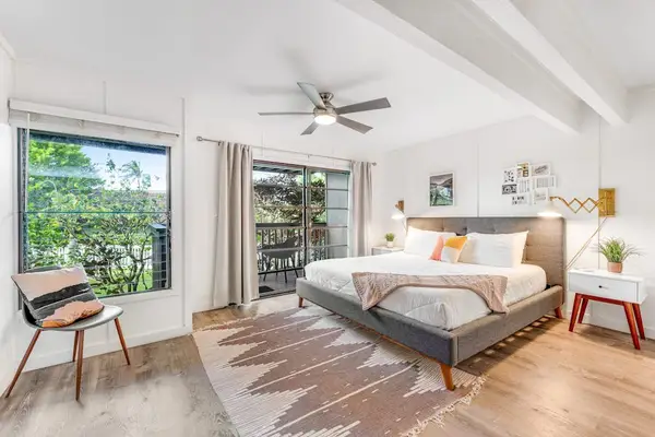 First Bedroom combines king bed sunshine leafy views and calm