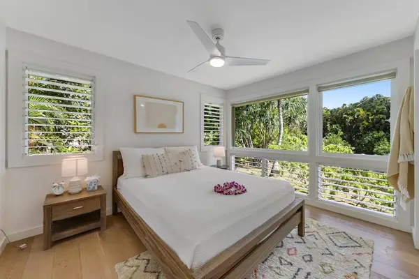 Quiet bedroom offers soft linens, bedside furnishings, and restful comfort