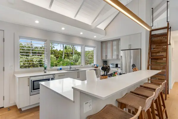 Well-planned kitchen provides functional counters, cooking equipment, and dining convenience.