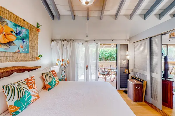 Peaceful bedroom captures island charm for restful evenings and refreshing vacation mornings