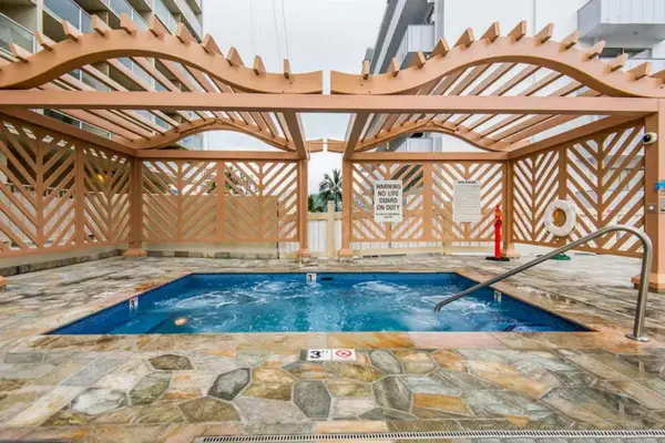 Enjoy a soothing soak in the shared hot tub during your stay