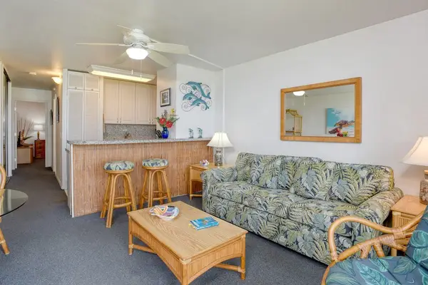 Open concept living room with sofa bed for guests.
