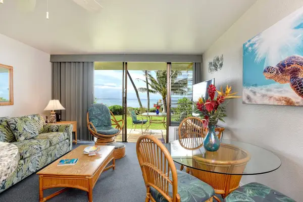 Living room with natural light from lanai doors.