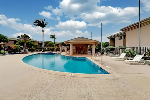 Sparkling Resort Pool Under Sunny Skies