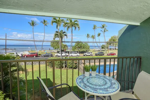 Private lanai with palm tree views — perfect for morning coffee