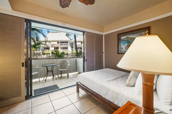 Queen bedroom open to the lanai for fabulous s tropical views.