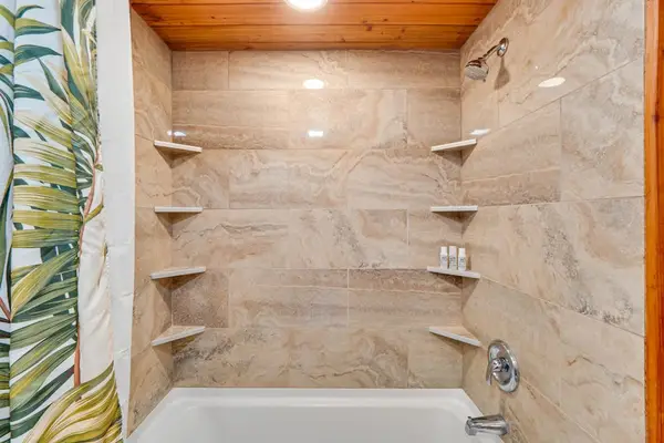 Master bathroom with lots of counter space and a tub/shower combo.