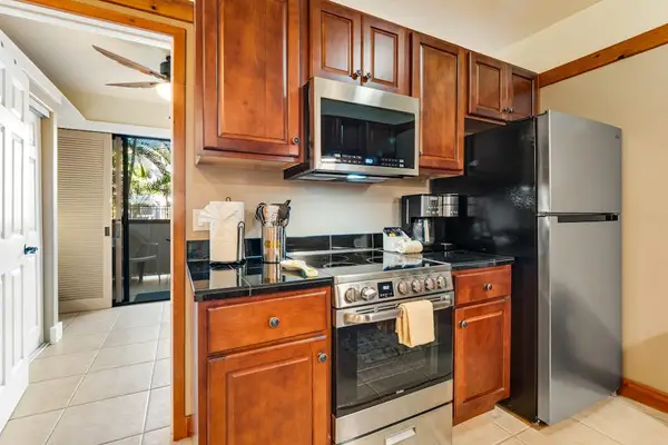 Well equipped kitchen with modern stainless steel appliances and new maple cabinetry.