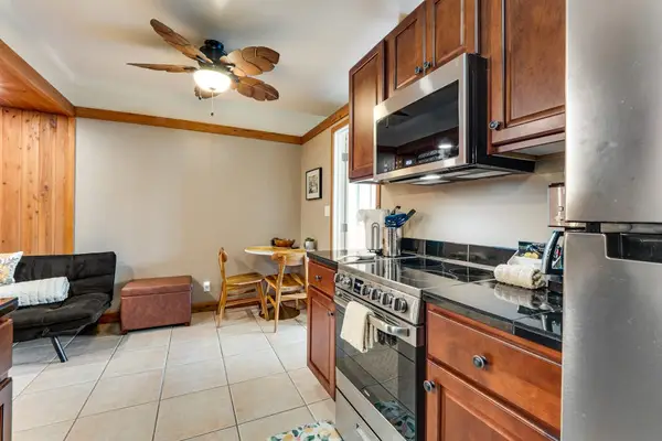 Well equipped kitchen with modern stainless steel appliances and new maple cabinetry.