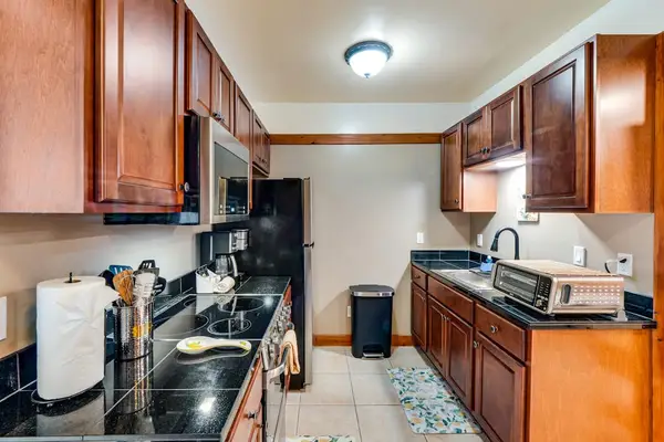 Well equipped kitchen with modern stainless steel appliances and new maple cabinetry.