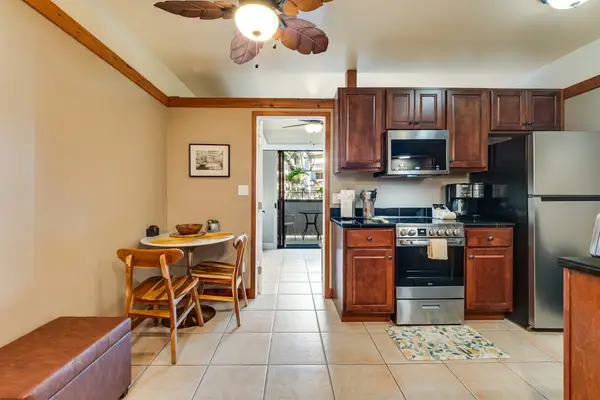 Fully sticked kitchen and a little bistro table
