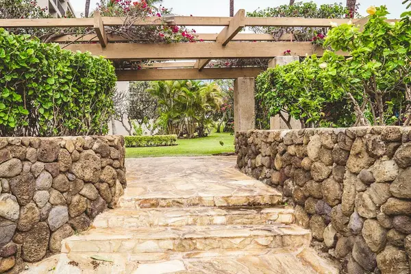 Stone Path Through Lush Gardens