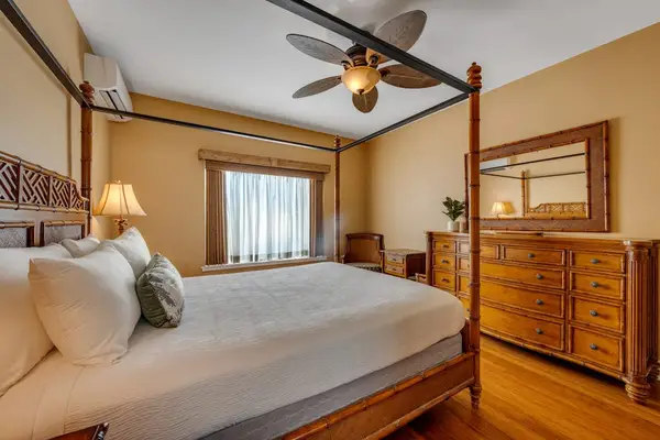 Comfortable guest bedroom with warm island style