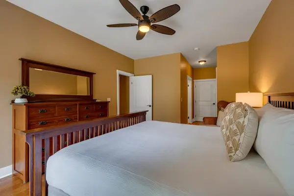 Spacious primary bedroom with a king bed