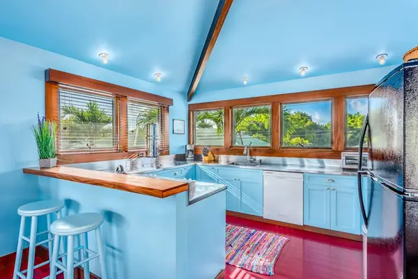 Spacious dining area within the kitchen offers coordinated seating beneath bright natural light