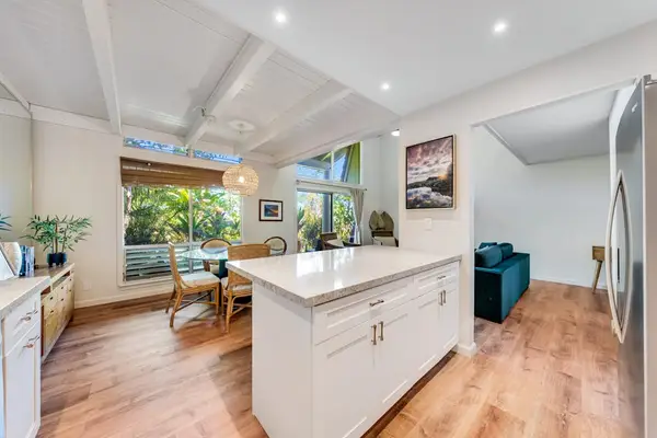 Modern open-concept kitchen featuring sleek stainless steel appliances, expansive countertops, and plenty of workspace for preparing everything from quick breakfasts to gourmet meals.