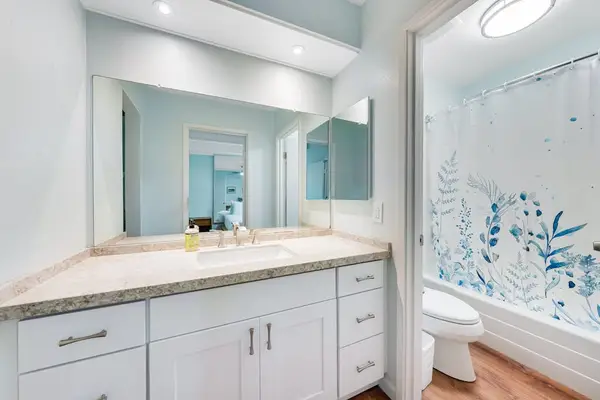 Guest bathroom with tub/shower combo.