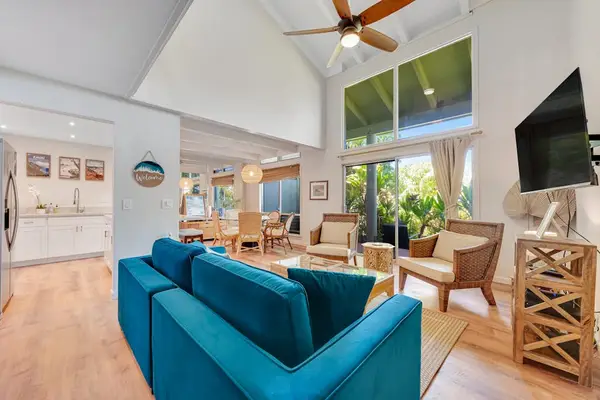 Open concept living room with access to the lanai bringing in the natural light and allowing amazing views.  There is also a flat screen TV for your enjoyment while you relax.