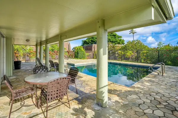 Princeville Paradise at Puamana community pool with covered seating to relax in the shade.