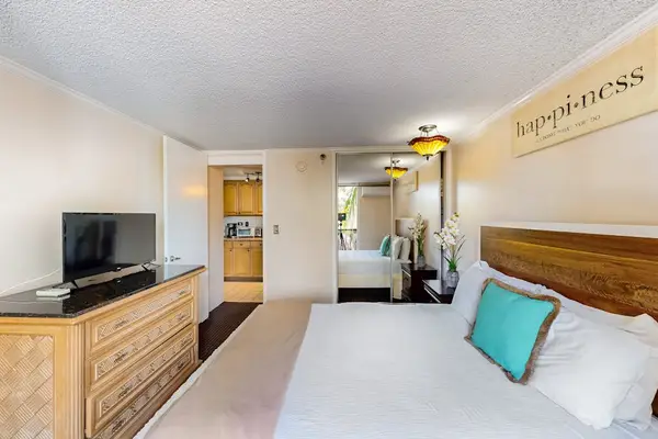 Relax in the comfortable bedroom with a TV for easy evening entertainment.