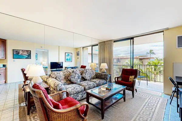 Bright Open Living Room with Sofa, Armchairs & Lanai Access