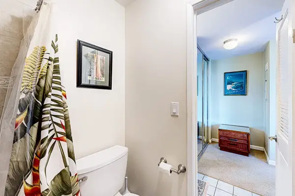 Bathroom Toilet Area & View into Primary Bedroom