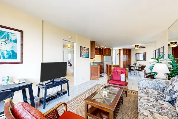 Living Area with Flat-Screen TV, Work Desk & Kitchen View