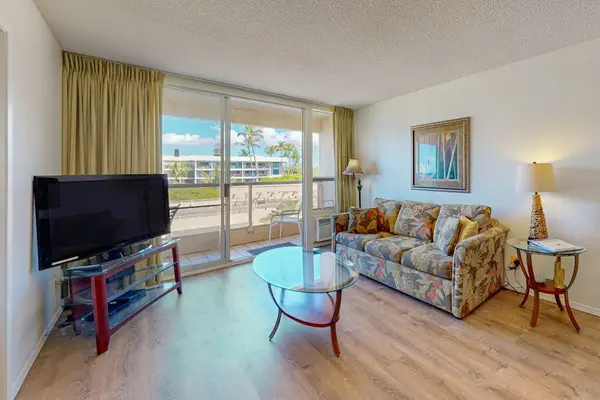 Bright living area with direct lanai access, welcoming fresh breezes and plenty of natural light