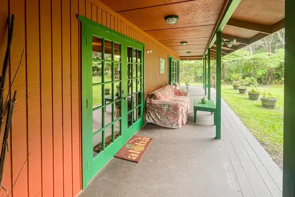 Relax on the front porch so you can take in the breathtaking views of the native forest