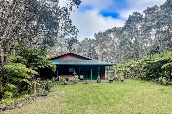 Escape to a private tropical backyard oasis surrounded by lush Hawaiian landscaping, swaying palms, and the peaceful beauty of paradise.
